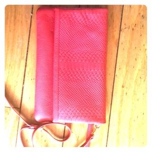 Foldover embossed python design clutch in Coral